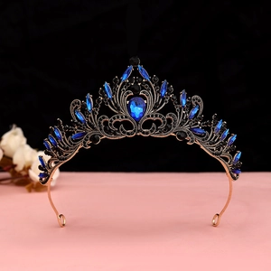 Detailed close-up of Gothic Baroque crown featuring deep blue teardrop rhinestones and scrollwork