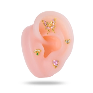 Pink butterfly and heart stud earrings set with sparkling cubic zirconia on model