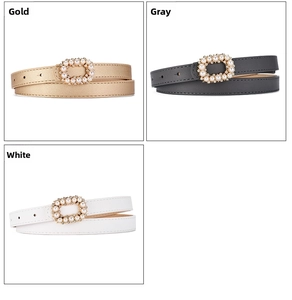 Close-up of pearl-encrusted gold, grey, and white slim leather belts for dresses