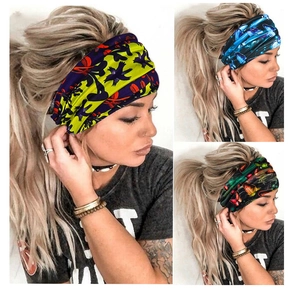 Detail of elastic headbands with vibrant butterfly and spider patterns for yoga