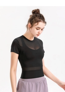 Close-up of black sports top featuring breathable mesh panels and high-elasticity fabric
