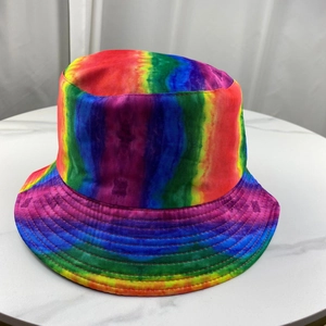 Close-up of vibrant rainbow tie-dye pattern on a foldable cotton fisherman bucket hat
