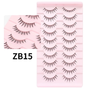 Detailed view of 10 pairs of black false eyelashes with natural flared volume on tray