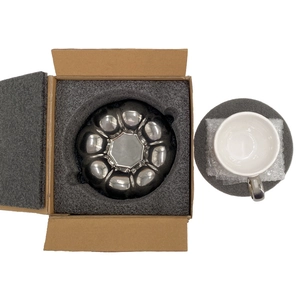 Nordic macaron sunflower ceramic coffee cup and silver handle saucer in protective packaging