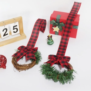 Christmas wreath with red and black plaid bow for kitchen cabinet door holiday decoration