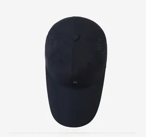 Top view of navy blue baseball cap showing laser-cut side vents and metal S logo