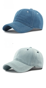 Close-up of classic washed denim baseball caps in medium blue and light blue tones