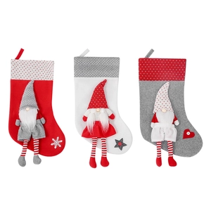 Three-piece set of Christmas gnome stockings in red, white and grey with hanging loops