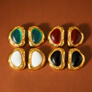 Close-up of retro 18k gold-plated irregular earrings with colorful resin inlay