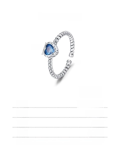 Macro shot of 925 sterling silver ring with 6x6mm blue heart stone and twisted band