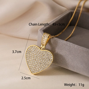 Detailed view of 18K gold heart pendant with dimensions 3.7x2.5cm and chain length specs