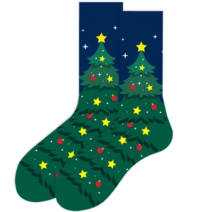 Detail of Christmas crew socks with green holiday tree patterns on a navy blue background