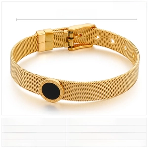 Detail view of gold mesh watch-band bracelet with Roman numeral disc and resin inlay