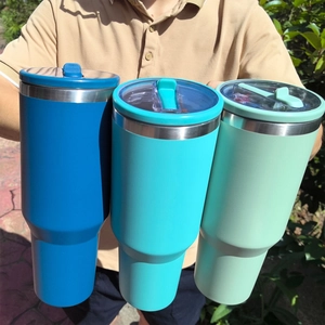 40oz stainless steel insulated tumblers with handles in blue and mint green colors