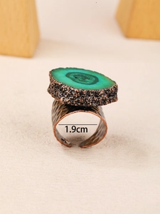 Detail shot of vintage bronze adjustable ring featuring a 1.9cm inner diameter size label