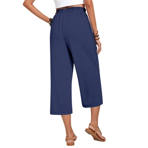 Rear view of high-waisted wide-leg linen trousers showing elastic waistband and fabric texture