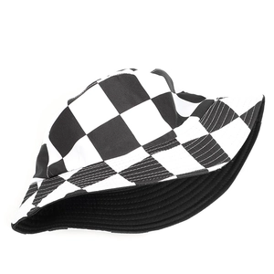 Detailed view of black and white checkerboard bucket hat with reinforced stitched brim edge