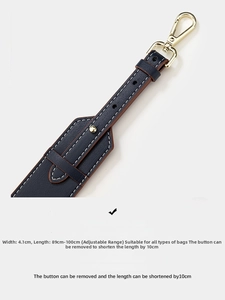 Detail of navy leather strap with gold hardware and dimensions 4.1cm width by 100cm length