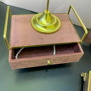 Luxury pink velvet jewelry organizer with gold metal frame and single drawer storage