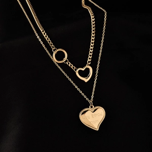 Double-layered gold titanium steel necklace with hollow and solid heart-shaped pendants