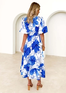 Detail of blue floral maxi dress with puff sleeves and elastic waist back view