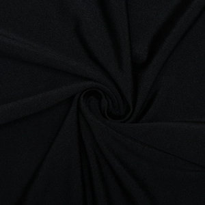 Close-up macro of black knitted fabric texture and elegant spiral draped folds
