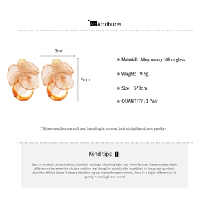 Detailed view of chiffon flower and resin earrings with 5x3cm dimensions and material specs