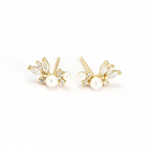 Elegant gold earrings with white pearls and marquise-cut crystals in a floral design