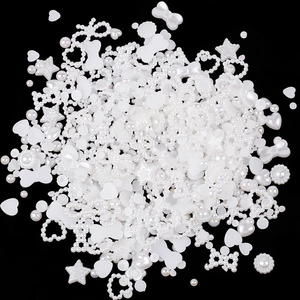 Mix of white and iridescent heart, star, and bow resin charms for nail art and DIY
