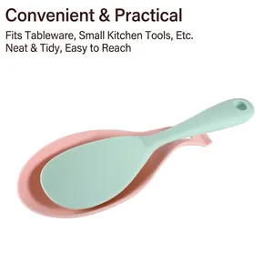 Pink food-grade silicone spoon rest with green spatula set for clean kitchen countertops