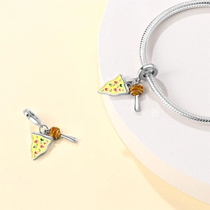 Detail of silver pizza and honey dipper enamel charms on a snake chain bracelet