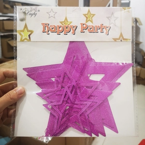 Close-up of sparkling magenta star party decorations in retail packaging for events