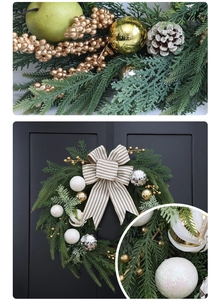 Detail of Christmas wreath with golden berries, pine cones and striped fabric bows