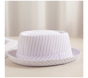 Detail of white pork pie hat with black stripes and elegant flat top textured fabric