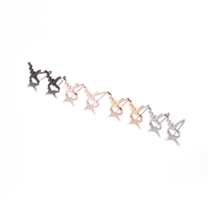 Detail of minimalist stainless steel pulse earrings in black, rose gold, gold and silver