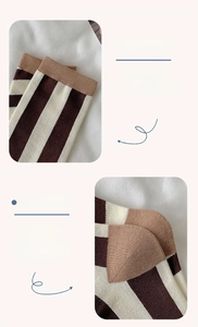 Macro detail of striped cotton crew socks featuring elastic cuffs and reinforced heel