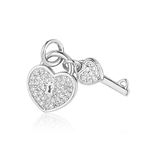 Macro detail of silver heart padlock pendant with micro-pave crystals and matching key