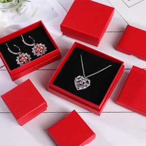 Detailed view of red jewelry gift box set with purple crystal heart necklace and floral earrings
