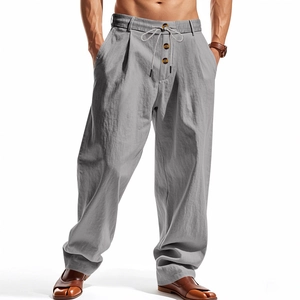 Detail view of men's linen pants with gray fabric texture, drawstring waist, and button fly