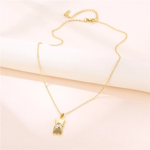 Minimalist gold titanium steel necklace featuring a rectangular bar pendant with zircon stone