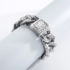 Macro detail of retro stainless steel snake bracelet with textured scales and antique finish