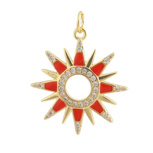 Macro view of 18K gold plated sunburst pendant with red enamel and pavé zircon stones
