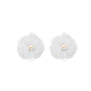 Detail of white fabric floral earrings with layered organza petals and yellow stamen