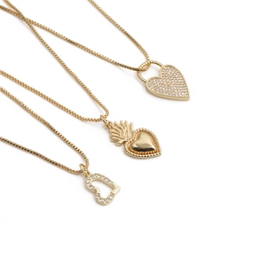 Golden heart lock necklaces with micro-paved zircons and sacred heart pendants