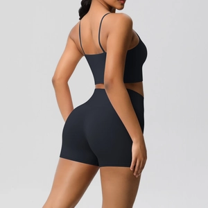 Rear view detail of black brushed yoga set with high waist shorts and strappy sports bra