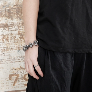 Close-up of men's vintage skull bracelet in titanium steel with retro oxidized finish