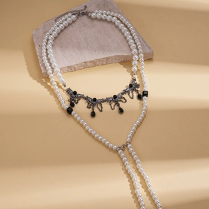 Vintage multilayer faux pearl necklace with black wing pendant and waterdrop charm