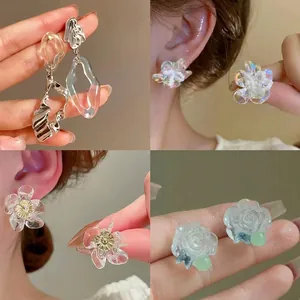 Minimalist resin flower butterfly earrings in various styles including pearl and silver needle