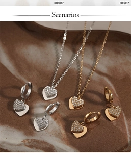 Macro detail of heart-shaped jewelry set with gold and silver cubic zirconia plating