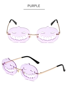 Detailed view of Halloween pumpkin sunglasses with purple lenses and gold metal temples